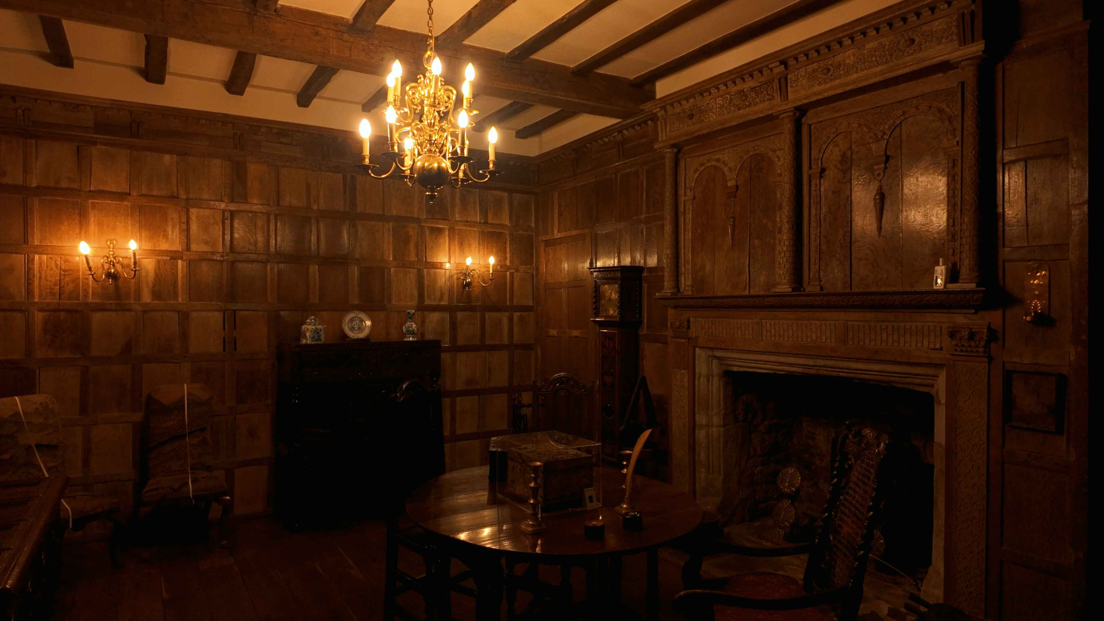 An elegant room adorned with wood paneling and a fireplace, providing a welcoming and comfortable environment