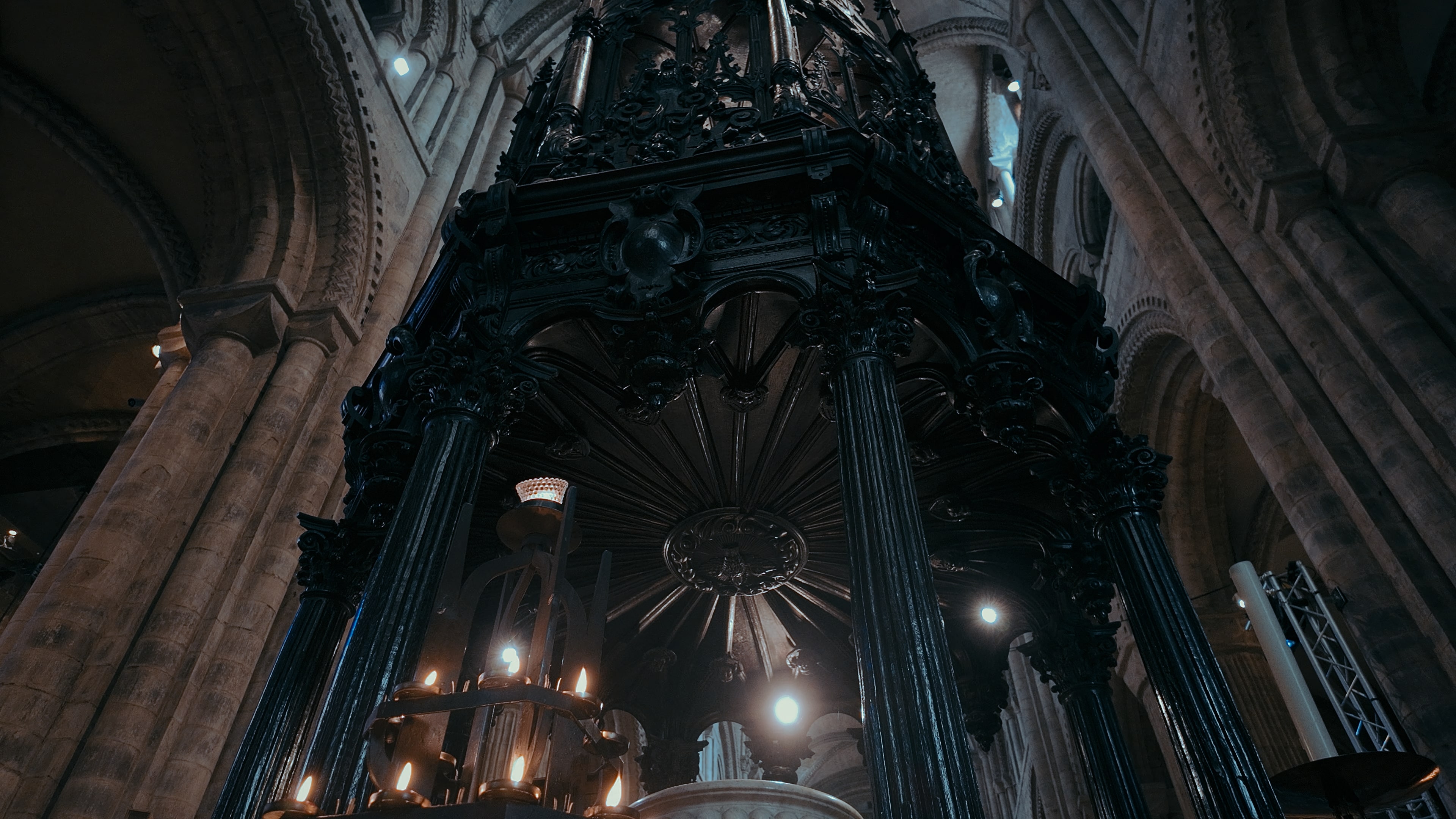 A large circular altar with prayer lights on the bottom left