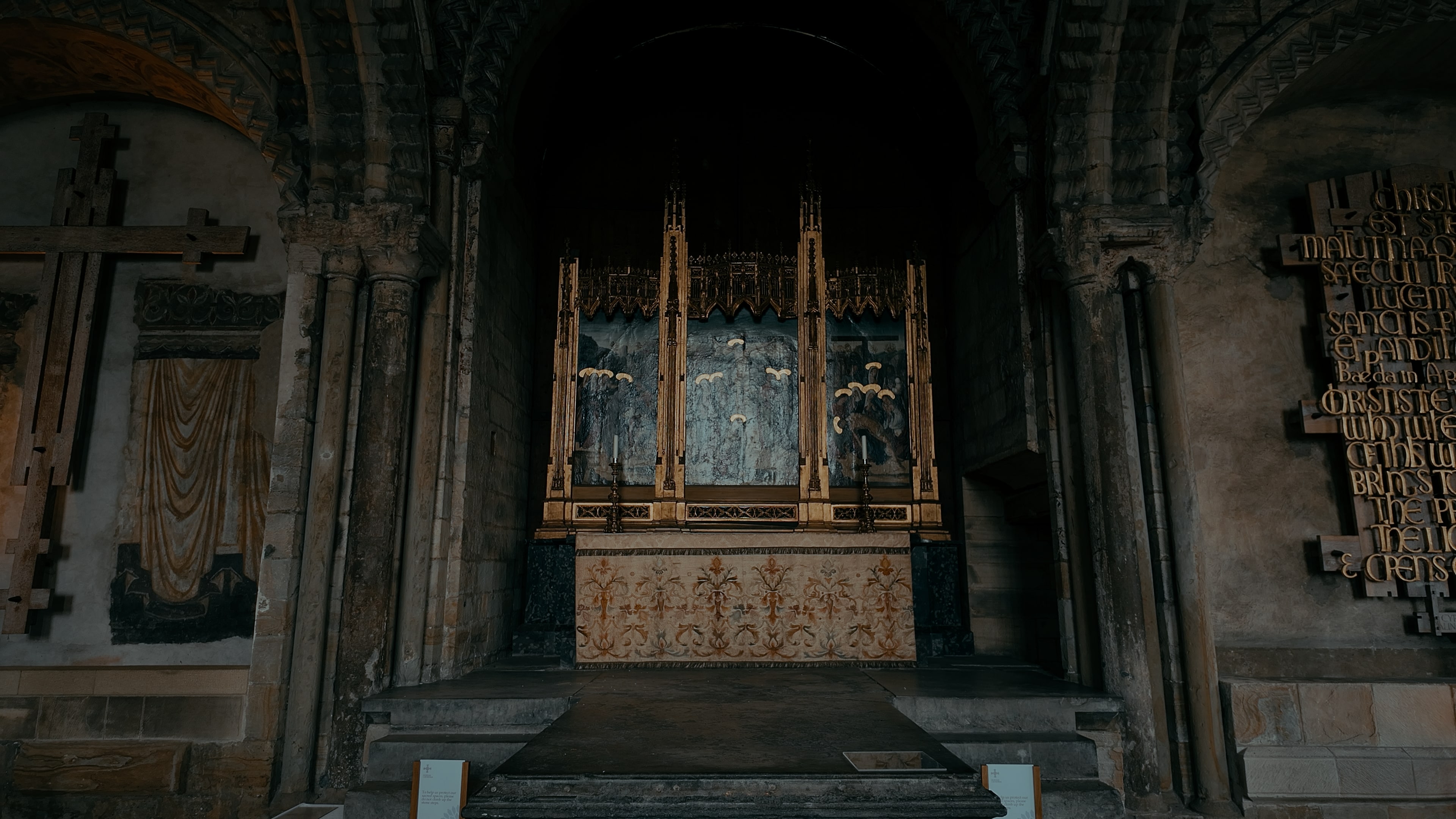 A gold shrine with stone steps on either side leading up