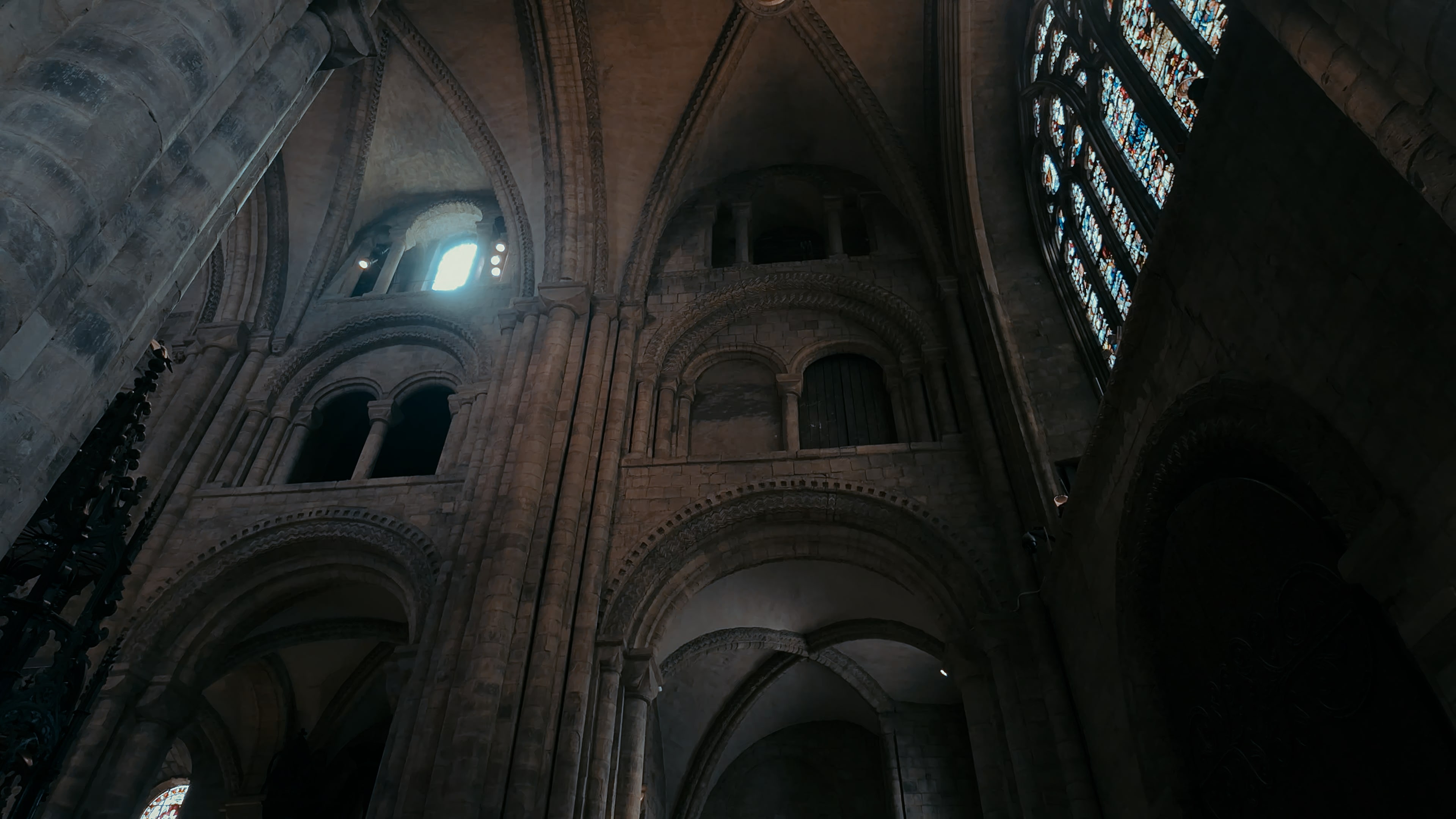 Several stoned archways at the corner of a cathedral